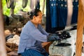 Older women dyeing cotton with natural indigo. Local Master are the original Indigo Cotton Weaving in the community of Sakon Royalty Free Stock Photo