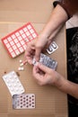 Senior Woman Taking Prescription Medicine and Organizing Pill Box