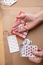 Senior Woman Taking Prescription Medicine and Organizing Pill Box