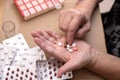 Senior Woman Taking Prescription Medicine and Organizing Pill Box