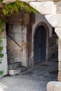 The oldest door crossing the old stone wall in Porto Royalty Free Stock Photo