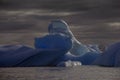 Deep blue ancient glacial iceberg, Antarctica