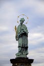 Oldest statue sculpture on Charles Bridge in Prague depicting St. John of Nepomuk