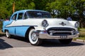 1955 Oldsmobile classic car on the parking lot during the Rock Around The Jukebox event. Rosmalen, The Netherlands - May 8, 2016