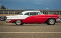 Oldsmobile standing in a parking lot. Beautiful vintage Oldsmobile 1957 Super 88 Coupe