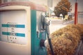 Oldtime or vintage Red white blue color fuel gasoline station box and dispenser in blur Europe background. S Royalty Free Stock Photo