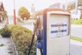 Oldtime or vintage Red white blue color fuel gasoline station box and dispenser in blur Europe background. S