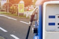 Oldtime or vintage Red white blue color fuel gasoline station box and dispenser in blur Europe background. S