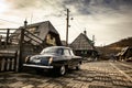 Oldtimer car Volga GAZ-21 built in a soviet Russia in traditional retro village