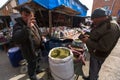 Man in the city market sells loose tobacco. In Bayan-Olgiy province is populated to 88,7% by Kazakhs.