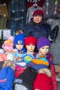 Unknown woman in the city market sells winter hats. In Bayan-Olgiy province is populated to 88,7% by Kazakhs