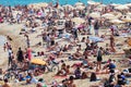 Olidaymakers sunbathe on beach in Barcelona