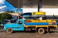 Tanker truck fills the reservoirs with fuel at a gas station belonging to the Ipiranga chain