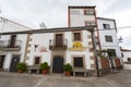 A typical house decorated with large flowerpots in the town of Oliva of Plasencia.