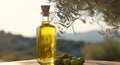 Olive fresh extra virgin oil in a glass bottle and green olives with leaves on nature. Bio product. Organic Farm