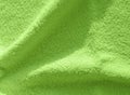 Olive green Terry towel, a simple example of the texture of a soft, fleecy fabric, background Royalty Free Stock Photo