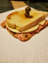 Olive loaf and pepperjack cheese on toasted bakery French bread with olives. Royalty Free Stock Photo