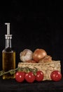 Olive oil and other nutricious ingredients against a black background