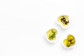 Olive oil as famous product of mediterranean cuisine. Heart shaped bowls with olive oil with green olives, rosemary and