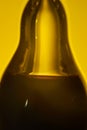 Olive oil and balsamic vinegar, in serarate parts of a pear-shaped glass bottle.