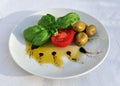 Olive oil, basil, tomato and green olives Royalty Free Stock Photo