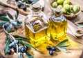 Olive oil and berries are on the olive wooden tray.