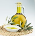 Olive oil Bottle and bowl plate with olive branch. Virgin olive oil. Natural olive oil, healthy food. Royalty Free Stock Photo