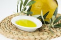 Olive oil Bottle and bowl plate with olive branch. Virgin olive oil. Natural olive oil, healthy food. Royalty Free Stock Photo