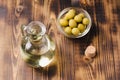 Olive oil in a bottle and fruits of olives in a bowl. Top view. Royalty Free Stock Photo