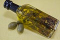 Olive oil bottle with herbs inside Royalty Free Stock Photo
