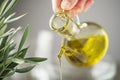 Olive oil bottle pouring close up Royalty Free Stock Photo