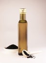 Olive oil in a bottle on a white background Royalty Free Stock Photo