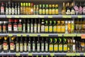 Olive oil of different brands in a grocery store. Large assortment of high quality healthy cooking olive oil. Minsk, Belarus, 2022