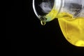 Olive oil drop from a bottle Royalty Free Stock Photo