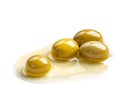 Olive oil drops isolated on white ceramic surface Royalty Free Stock Photo