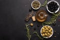 olive oil in a glass bottle with olives, herbs and spices Royalty Free Stock Photo