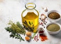 Olive oil in a glass bottle, spices and herbs on a light background. Generated AI Royalty Free Stock Photo