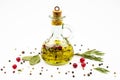 Olive oil in a glass bottle, spices isolated on a white background Royalty Free Stock Photo