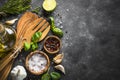 Olive oil, herbs and spices on a dark stone table. Royalty Free Stock Photo