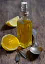 Olive oil and lemon fruits on the wooden table Royalty Free Stock Photo