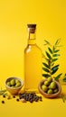 Olive oil and olives. Bottle of oil. olives twigs and pepper on yellow.