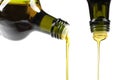 Olive oil pouring from glass bottle Royalty Free Stock Photo