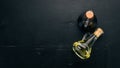 Olive oil and soy sauce in glass jars. Spices and Sauce. Top view. On a black wooden background.