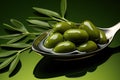 Olive oil in a spoon with green olive fruits, culinary background