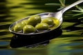 Olive oil in a spoon with green olive fruits, culinary background