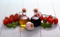 Olive oil and vinegar in bottles on wooden table Royalty Free Stock Photo