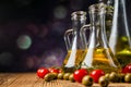 Olive oils in bottles with ingriedients Royalty Free Stock Photo