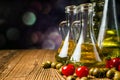 Olive oils in bottles with ingriedients Royalty Free Stock Photo
