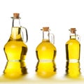 Olive oils three rusty cruets isolated Royalty Free Stock Photo