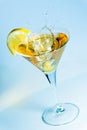 Olive splashing on a glass of martini Royalty Free Stock Photo